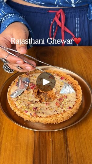 209K views · 4.2K reactions | Rajasthani Ghewar 🌹✨ This crunchy, crispy, and delightful Ghewar will be the best mithai you make this festive season. The unique preparation, flavours and its history makes this dish so special for all celebrations! Welcome to episode 6 of ✨ #MithaiMagic ✨ a series where we’ll discover the magic of mithai-making together, one recipe at a time ❤️ Here’s how you make this delicious Instant Rabri at home ☺️ Ingredients: Ghee - 1/4th Cup Flour - 1 Cup Besan/ Chickpea Flour - 1 Tbsp Salt - A pinch Chilled Milk - 1/4th Cup Chilled Water - 1/2 Cup Lime Juice - 1 Tsp Ice Cubes - 4 nos Sugar Syrup Water - 1 Cup Sugar - 1/2 Cup Lemon Juice - 1/2 Tsp Cardamom Pods - 3 nos Rose Water - 1 Tsp Process : * For the batter : to a bowl, add ghee & a few ice cubes - mix u Ghewar Recipe, Cardamom Pods, Sugar Syrup, Chickpea Flour, Ice Cubes, Ghee, Rose Water, Be The Best, Meals For One