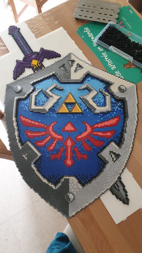 Zelda Perler Bead Patterns, Hylian Shield, Cross Stitch Projects Ideas, Pixel Beads, Easy Perler Beads Ideas, Fuse Bead Patterns, Perler Bead Templates, Perler Crafts, Diy Perler Bead Crafts