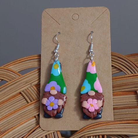 Are you ready for spring? These little guys are! 🌸 Spring Garden Gnomes 🌸 3 Pairs Available! $20 and free shipping ☺️ #smallbusiness #shoplocal #supportsmallbusiness #smallcreator #gnomes #handmade #earrings #noveltyearrings #noveltyjewelry #polymerclay #camp #funkyearrings #maximalist Simply Clay Gnome Earrings, Polymer Gnome Earrings, Whimsical Spring Earrings With Flower Charm, Gnoce Jewelry, Winter Gnome Clay Earrings, Garden Gnomes, Funky Earrings, Polymer Jewelry, Gnome Garden