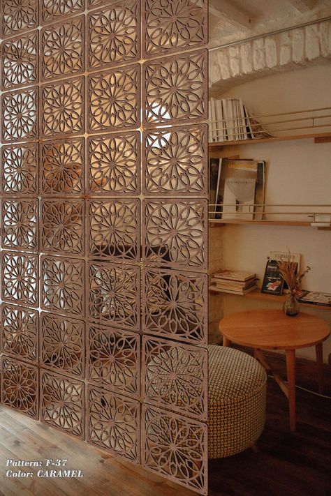 Room dividers combine aesthetic appeal with usefulness, making them a crucial component of contemporary interior design. There are plenty of possibilities to fit your needs, whether you're trying to make discrete places in a large living room or finding creative ways to arrange a small bedroom. Parisian Room Divider, Hanging Dividers For Rooms, Random Space Decor, Room Divider For Home Office, Short Room Divider, Room Divider Office Space, Wooden Dividers Living Rooms, Diy Room Separator, Room Dividers For Studio Apartments