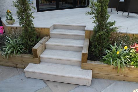 Raised deck Millboard terrace with steps leading down to a sun terrace. Raised Garden Terrace, Raised Terrace Patio, Raised Patio Garden Ideas, Patio With Steps Up To Garden, Raised Garden Patio, Step Down Garden, Raised Patio With Steps, Decking With Steps, Decking Steps Down To Garden