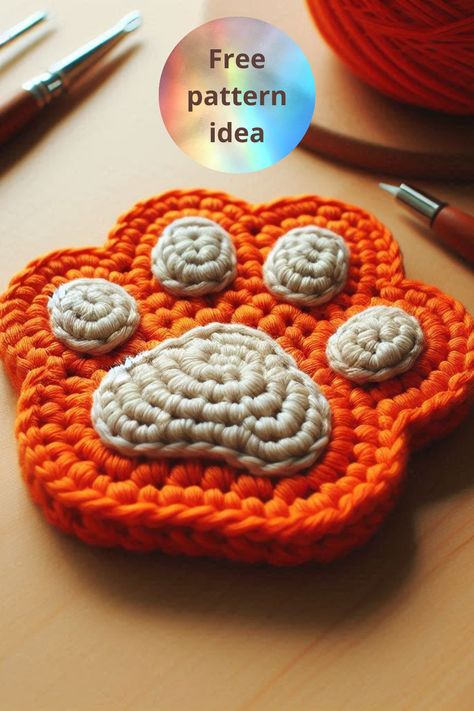 Learn how to make an adorable crochet paw print coaster with this easy and creative tutorial. Perfect for protecting your table with charm! Crochet Paws Pattern Free, Paw Print Coaster Crochet Pattern Free, Cat Paw Crochet Pattern, Paw Crochet Pattern Free, Crochet Paw Print Pattern Free, Paw Print Crochet, Crochet Paw Print, Paw Crochet, Coastal Crochet