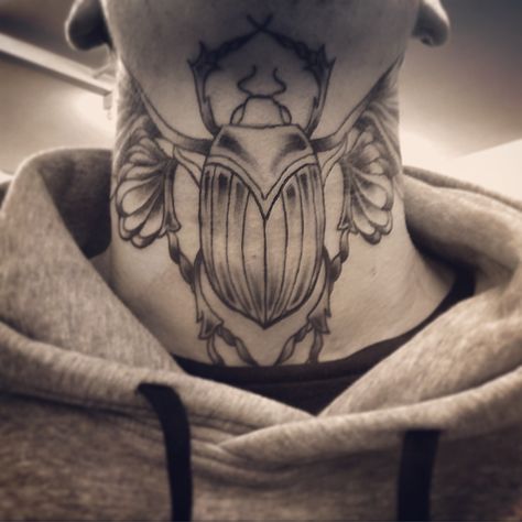 Egyptian scarab beetle throat / neck tattoo Scarab Neck Tattoo, Beetle Neck Tattoo, Egyptian Symbol Tattoo, Scarab Beetle Tattoo, Conscious Art, Scarab Tattoo, Egyptian Scarab Beetle, Egyptian Beetle, Beetle Tattoo