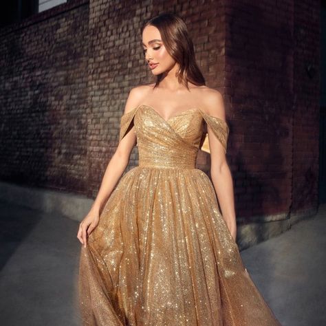 The Elegant Dress That Is Perfect For A Formal Event Is Made Of Delicate Glitter Tulle, Which Makes The Skirt Voluminous Creating A Light Image, While The Off Shoulder Neckline Will Complement The Image With Exquisite Jewelry. Fabric: Tulle Length: Tea Length Colour: Gold Neckline: Off Shoulder Silhouette: A-Line Sleeve: Sleeveless Back: Zipper Embellishments: Glitter Occasion: Romantic Date/Evening/Dinner, Wedding/Bridesmaid, Graduation, Fashion Show, Visiting Theater/Museum/Restaurant, Banquet Evening Dresses Elegant Off Shoulder, Cinderella Gold Dress, Gold Midi Dress Bridesmaid, Gold Off The Shoulder Prom Dress, Soft Gold Wedding Dress, Gold Dress Graduation, Gold And Purple Wedding Dress, Gold Masquerade Dress, Gold Sparkle Prom Dress