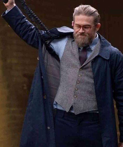 Charlie Hunnam The Gentlemen Blue Trench Coat Ah, “The Gentlemen”! Released in 2019, this Guy Ritchie masterpiece had us gripped from the get-go. It’s one of those movies that has Ritchie’s signature style written all over it, complete with intricate plots, swift narrative shifts, and oh-so-memorable characters. And among those characters, Charlie Hunnam’s portrayal of Ray stole the show for us.  Ray, as depicted by Hunnam, is a sharp, meticulous right-hand man to Matthew McConaughey’s Mickey Pearson. Throughout the movie, Ray’s calm and collected demeanor contrasts brilliantly with the chaotic world of drug lords and blackmailers. Charlie Hunnam delivers a layered performance, ensuring Ray isn’t just another tough guy but rather a multifaceted character, loyal yet analytical, who you’d wa The Gentleman Charlie Hunnam, Charlie Hunnam Gentlemen, The Gentlemen Movie Style, Charlie Hunnam The Gentlemen, Grey Coat Outfit, Gentleman Movie, Peaky Blinders Thomas, The Gentlemen, Jacket Store