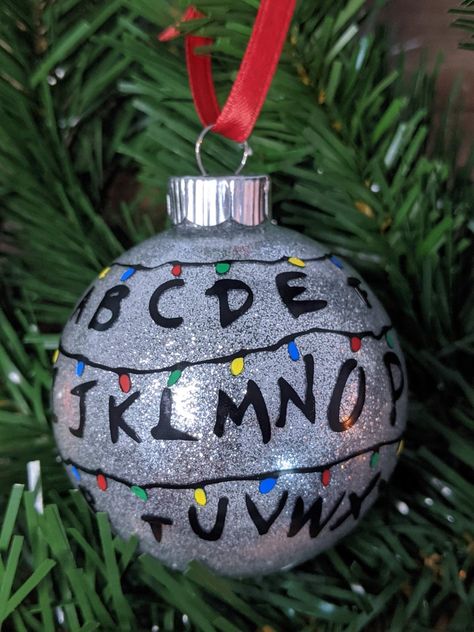 Stranger Things Christmas Ornament Glass | Etsy Stranger Things Ornament, Christmas Homemade Ornaments, Stranger Things Christmas Lights, Stranger Things Alphabet, Ball Ornaments Diy, Stranger Things Lights, Christmas Ball Ornaments Diy, Xmas Bulbs, Stranger Things Christmas