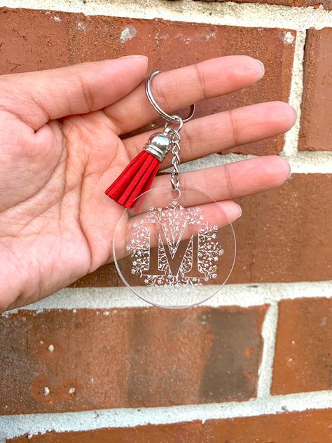 Whether is your own initial or a loved one, this engraved keychain will last forever! The perfect gift to anyone ❤️ Dimensions: Circle is 2 inches Initial approximately 1.3 inches Personalization: It includes engraved keychain and tassel Purse NOT included Material: Durable high quality acrylic Please read the information below carefully: - Colors of the actual product may vary when viewing from different devices. - For wholesale orders, please make sure to contact me. If the amount of keychains Engraved Keychain Cricut, Personalized Keychain Ideas, Acrylic Engraved Keychain, Engraved Keychain Ideas, Free Keychain Svg, Acrylic Circle Keychain, Engraved Acrylic Keychain, Laser Acrylic, Keychain Svg