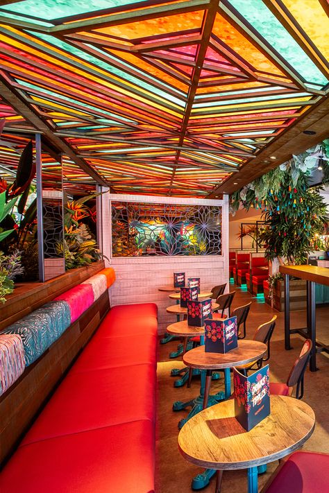 Beautiful tropical restaurant and bar design. Interior design for rainforest inspired Indian bar restaurant. Colourful, funky, bold, eye-catching. Instagrammable interior design. Trees, planting and flowers restaurant. Aesthetic Mexican Restaurant, American Design Interior, Tropical Restaurant Design, Mexican Restaurant Aesthetic, Ministry Aesthetic, Instagrammable Interior, Mexican Interior Design Modern, Indian Restaurant Interior Design, Taqueria Design