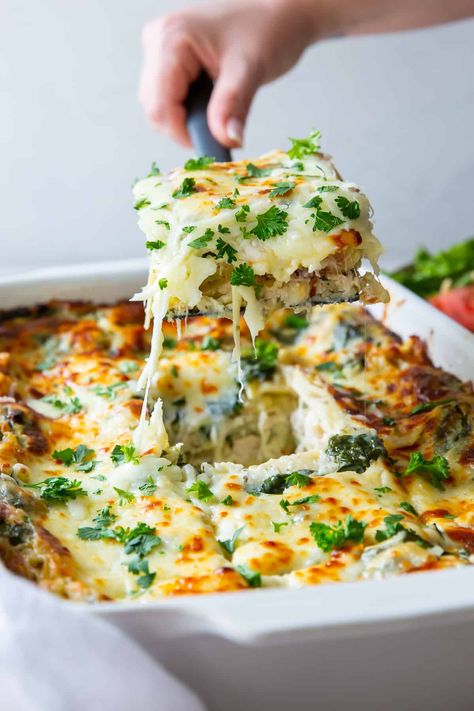 This White Chicken Lasagna is layered with a creamy spinach white sauce and baked until tender and golden brown. This easy chicken lasagna recipe utilizes store-bought rotisserie chicken and is a delicious make-ahead meal! Easy Chicken Lasagna Recipe, Baked Chicken Pasta Recipes, Chicken Lasagna Recipe, White Chicken Lasagna, Chicken Pasta Casserole, Cheesy Chicken Pasta, White Lasagna, Pasta Casserole Recipes, White Sauce Recipes