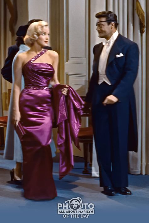 MARILYN MONROE PHOTO OF THE DAY — That purple dress! Marilyn Monroe (Pola) and Alex D'Arcy (J. Stewart Merrill) in "How To Marry A Millionaire" (1953) Trivia: D'Arcy and Marilyn had a chance meeting while she was still Norma Jeane while she was modeling for photographer, Andre de Dienes in the late 40s.💋. #Photooftheday #MarilynMonroePhotos #AllAboutMarilyn #MarilynMonroe #marilyn #Hollywood #OldHollywood Marilyn Monroe Purple Dress, Marilyn Monroe How To Marry A Millionaire Dress, Marlen Monro Dress, Iconic Purple Dress, Marilyn Monroe Iconic Dress, Marilyn Monroe Dresses Outfits, Iconic Hollywood Dresses, Old Hollywood Glam Dresses Evening Gowns, Old Hollywood Style Dresses