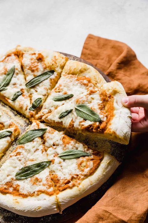 Comfort food meets the Autumn season with this pumpkin pizza. This 20 minute pizza is made with pumpkin pizza sauce, fresh sage, cheese, and fresh homemade pizza dough, you know it’s going to be good! Pumpkin Pizza, Delicious Pizza Recipes, Pumpkin Sauce, Fresh Sage, Cooking Pizza, Homemade Pumpkin Puree, Making Homemade Pizza, Homemade Pizza Dough, Pizza Recipes Homemade