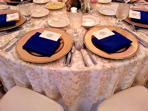 Gold lace table linens with royal blue accents | Blue and gold wedding by Table Covers & More Royal Blue And Champagne Gold Wedding Decorations, Shadi Decor, Champagne Gold Wedding, Blue And Gold Wedding, Blue Gold Wedding, Quince Dress, Gold Wedding Decorations, Wedding Pic, Royal Blue And Gold