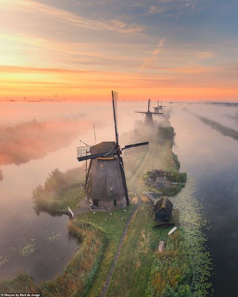 KLM airline pilot Nick de Jonge is flying high on Instagram thanks to amazing drone photography  | Daily Mail Online Windmill Images, Klm Airlines, Haarlem Netherlands, Sand Island, Airline Pilot, North Holland, Dutch Windmills, Morning Sunrise, Foggy Morning