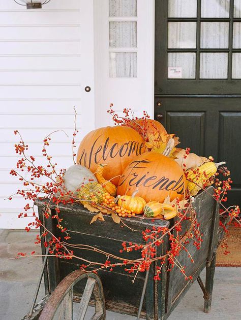 Pumpkins, gourds, leaves, and berry vines make for a festive front entry! Get more pumpkin and fall entry decorating ideas. Pumpkins And Gourds, Dekorasi Halloween, Hallowen Ideas, Halloween Porch Decorations, Fall Deco, Halloween Door Decorations, Autumn Decorating, Fall Outdoor Decor, Fall Decorations Porch