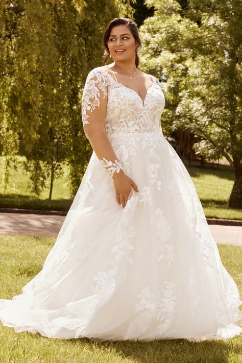 Classic Floral Lace A-Line Wedding Gown Liliana. Description: For the bride who's looking for something classic and romantic, Liliana is the perfect dress for you! Layers of tulle and floral-inspired lace come together to create a classic A-line wedding gown that is truly unique. The detailed semi-sheer bodice offers a flattering V-neckline framed by narrow lace straps, leading to a striking illusion lace back that only Long Sleeve Ballgown, Ballgown Wedding Dress, Plus Wedding Dresses, Long Sleeve Ball Gowns, Sophia Tolli, Ballgown Wedding, Crepe Wedding Dress, Plus Size Wedding Gowns, Illusion Tulle