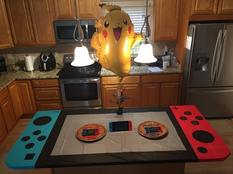 Nintendo switch party table I made. Nintendo Switch Table, Nintendo Themed Party, Switch Party Decorations, Kirby Party Decorations Idea, Super Smash Bros Party Decorations, Switch Party Ideas, Nintendo Switch Party Decorations, Nintendo Party Decorations, Kirby Birthday Party Ideas For Boys