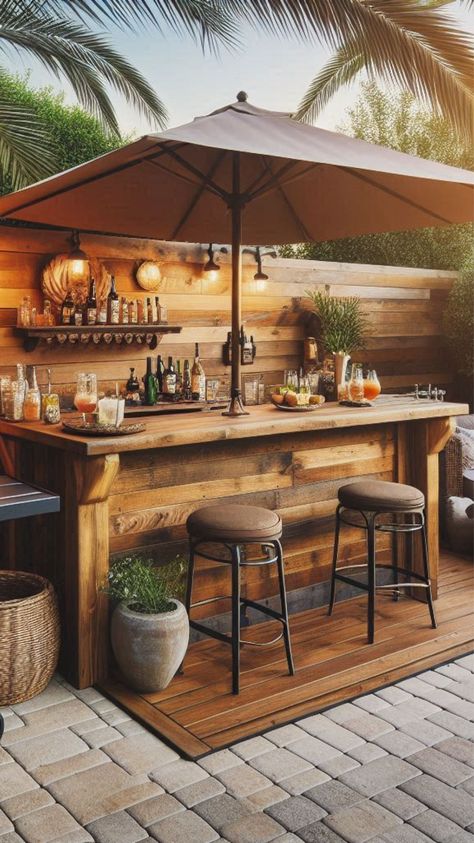 Elevate your outdoor space with chic backyard bar designs. I have shared rustic bar ideas, tiki bars, modern, stone, pallet, and DIY outdoor bar ideas. Check the article for more ideas!Bar Outdoor Design, outdoor bar for party, outdoor bar modern Patio Bars Outdoor Diy, Bar Deck Ideas, Outdoor Bar Setup For Party, Mini Bar Outdoor, Rooftop Bar Ideas, Small Outdoor Bar Ideas Backyards, Outside Bar Ideas Diy, Tiki Bar Ideas Diy, Backyard Tiki Bar Ideas