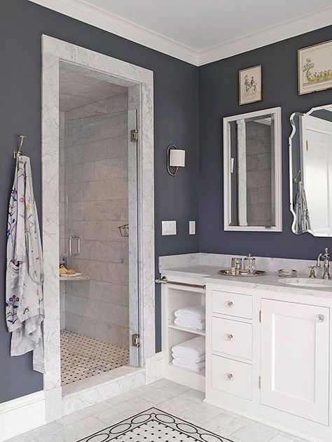 Even the smallest bathroom can accommodate bounteous style. Though diminutive in dimension, this walk-in shower makes an impact thanks to its marble door frame and tiled interior, which are highlighted by charcoal walls. http://www.bhg.com/bathroom/shower-bath/walk-in-showers-for-small-bathrooms/?socsrc=bhgpin042015charcoalbathroom&page=3 Color Bathroom Design, Gray Tile, Ideas Baños, Small Bathroom With Shower, Coastal Bathroom, Coastal Bathrooms, Subway Tiles, Small Bath, White Vanity