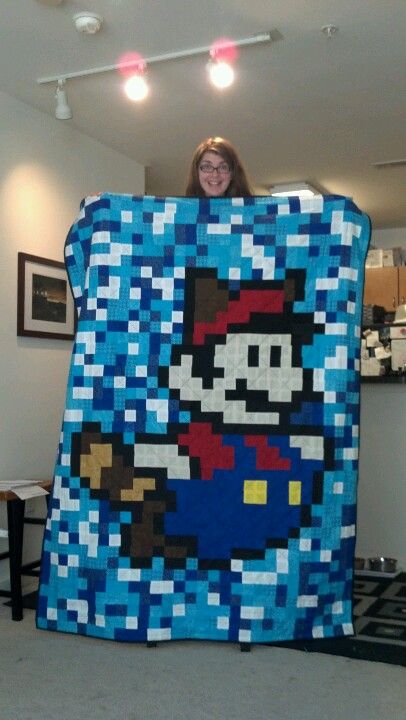 8 bit Super Mario quilt--lightweight, measures 60 x 80 inches. I gave this to my brother and sister-in-law. Super Mario Quilt, Mario Quilt Pattern, Nerdy Quilts, Alpha Graph, 8 Bit Crochet, Mario Blanket, Pixel Quilts, Mario Quilt, Pixel Quilt