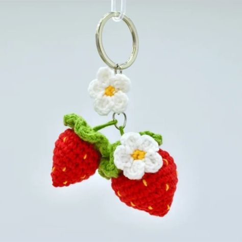 Get a taste of summer all year round with this adorable Crochet Strawberry Keychain adorned with pretty flowers 🌺🍓 Perfect for adding a pop of colour to your keys or bags. Handmade with wool, this keyring is perfect for beginners! #crochetkeyring #strawberrycharm #handmade #beginnercrochet #keyring #cute #summerfeels Crochet Strawberry Keychain, Crochet Cords, Strawberries And Flowers, Strawberry Keychain, Strawberry Charm, Crochet Strawberry, Crochet Cord, Adorable Crochet, Bags Handmade