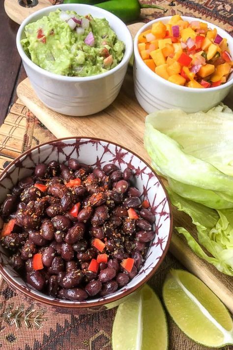 Perfect for a quick and healthy meal, this easy recipe for vegetarian black bean tacos is delicious! Plus, there are so many variations for this black bean, vegan filling! #tacotuesday #blackbeantacos #texmex Bean Lettuce Wraps, Salat Wraps, Vegetarian Lettuce Wraps, Taco Wraps, Lettuce Tacos, Taco Lettuce Wraps, Black Bean Tacos, Fresh Guacamole, Bean Tacos