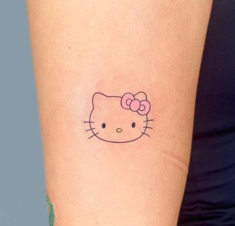 Tattoo #tattooedwomen #tattoosnob #hellokittyjunkie Hello Kitty Line Art Tattoo, Hello Kitty Small Tattoo, Pink Hello Kitty Tattoo, Hello Kitty Outline Tattoo, Simple Hello Kitty Tattoo, Smaller Tattoo Ideas For Women, Tatuajes Hello Kitty, Tatuajes Hello Kitty Tattoos, Tattoo Ideas Hello Kitty