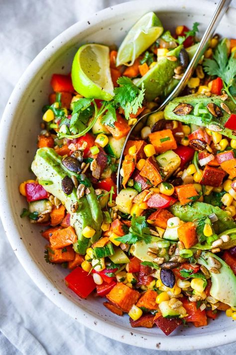 This roasted sweet potato salad recipe is punchy and flavorful! Made with fresh corn, zucchini, avocado, peppers, and cilantro tossed in a lively cumin lime dressing, it's the perfect blend of spicy, sweet, and zesty! Vegan & gluten-free. Roasted Sweet Potato Salad, Sweet Potato Salad Recipe, Corn Zucchini, Yam Or Sweet Potato, Sweet Potato Salad, Light Dinner Recipes, Roasted Sweet Potato, Potato Salad Recipe, Toasted Pumpkin Seeds