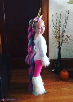 My daughter Aubrey is wearing a unicorn costume that is home made. I bought the fabric for the leg warmers and hand cuffs at Jo Ann's fabric for $9 and just used a hot glue gun to get their shape. I bought the hair from... Diy Fantasia, Unicorn Halloween Costume, Spooky Halloween Costumes, Costume Works, Diy Kostüm, Unicorn Halloween, Unicorn Costume, Halloween Costume Contest, Toddler Halloween Costumes