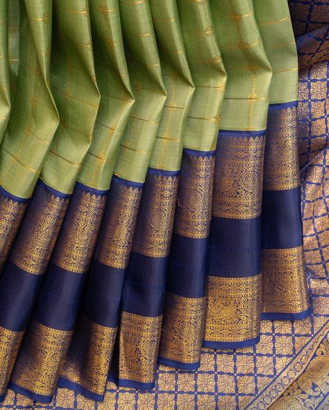 Add elegance to your wardrobe with Sage Green and Dark Blue Kanchipuram silk saree. The body is woven with ornamental zari checks and korvai woven dark blue rettai pettu borders, perfect for any occasion. Elevate your style with this luxurious and timeless saree. Saree code: CL602404 Korvai Silk Sarees Kanchipuram, Sage Green And Dark Blue, Saree Colours, Silk Sarees Kanchipuram, Silk Saree Kanchipuram, Engagement Rings Twisted, Elegant Saree, Kanchipuram Silk Saree, Silk Saree