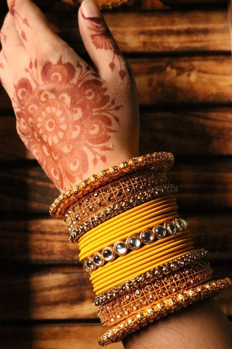 Bridal yellow bangle set. Follow us on instagram- studio_kalai Yellow Chudi Set, Bangle Setting Ideas, Yellow Bangles Set, Bangles Photography, Bangle Photography, Haldi Function Decoration, Yellow Bangles, Bridal Bangle Set, Haldi Function