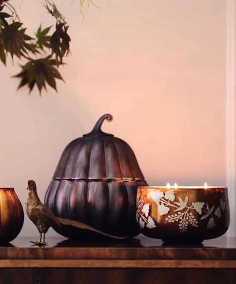 Anthropologie's Halloween collection – 18 of our top picks | Anthropologie Candle, Pumpkin Table Runner, Pumpkin Planter, Holiday Hosting, Halloween Trends, Festive Centerpieces, Anthropologie Home, Halloween Table Decorations, Hosting Holidays