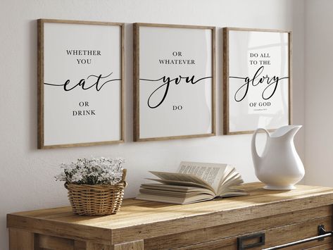 1 Corinthians 10:31 Bible Verse Wall Art to suit any Farmhouse Kitchen or Dinning Room. This scripture Set of 3 features NKJV biblical quote of ‘Whether you eat or drink’ and would look great above your dinning room table. Upon purchase you will receive Digital Printable Files in a range of different sizes immediately to decorate your Christian Home Decor today! Bible Verse For Dining Room, Christian Table, Dining Room Wall, Dining Room Wall Art, Table Art, Kitchen Posters, Art Bible, Wall Frames, Farmhouse Wall Art