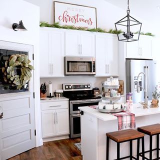 Im working on my Christmas Home Tour blog post this afternoon and thought Id share a sneak peek of the kitchen The large Merry Christmas sign made by ndcircledesign makes the entire space Thank you again for sending it to me A statement sign green garland and a cheery coffee bar are all you need to add a little festive flair to your kitchen Then bake all the cookies so it smells divine I still need to get to that part Anyone else planning on baking Christmas cookies What are your favorite Mine Diy Kitchen Makeover Ideas, Farmhouse Christmas Kitchen, Above Kitchen Cabinets, Above Cabinets, Kitchen Diy Makeover, Farmhouse Style Christmas, Kitchen Cabinets Decor, Kitchen Decor Ideas, Kitchen Decor Themes