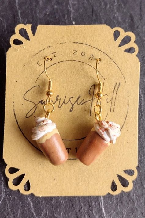 Looking for a fun piece of jewelry to show off your whimsical side? Are you searching for a unique gift? These polymer clay pumpkin spice latte earrings will leave your mouth watering! They're sure to make you stand out in a crowd or make a fun gift!
Each earring dangles from a copper-plated sterling silver gold-colored hook and comes with a rubber earring back.
Check it out on Etsy by clicking the link! Earrings Coffee, Coffee Earrings, Clay Pumpkin, Earrings Handmade Clay, Coffee Earring, Food Earrings, Clay Food, Fun Easy Crafts, Fall Jewelry