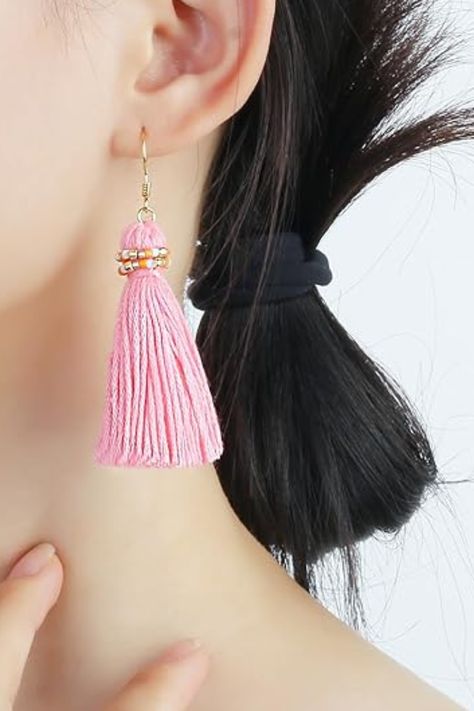 These vibrant pink tassel earrings are the perfect fashion accessory to add a playful touch to your style. Featuring soft threads and gold accents, they create a bold yet chic look, making them ideal for both casual and dressy outfits. A stylish accessory that enhances any wardrobe with a pop of color and flair. Pink Tassel Earrings, Pink Tassel, Chic Pink, Unique Materials, Chic Handbags, Dressy Outfits, Chic Accessories, Chic Woman, Stylish Fashion