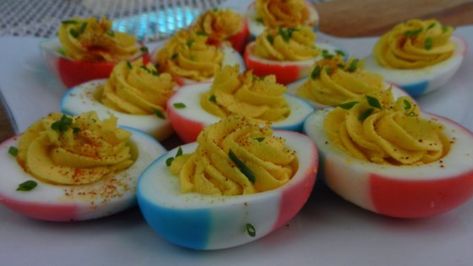 These slightly spicy deviled eggs are perfect for any patriotic celebration! Blue Deviled Eggs, Memorial Day Food Ideas, Memorial Day Food, Red White And Blue Fruit, Patriotic Recipes, Spicy Deviled Eggs, Blue Cheese Burgers, Patriotic Food, Blue Fruit