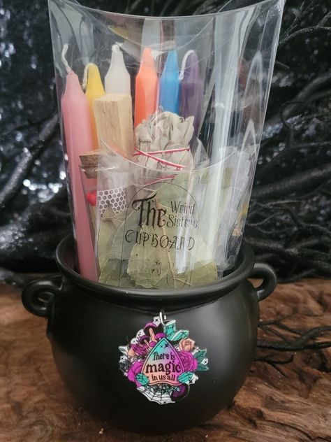 "This Fire Magic Candle gift set is a perfect for that Baby Witch or someone just starting out. It includes 7 different Color Chime Candles, a Chime Candle holder, Bay Leaves to write your Intensions, Selenite Tower, Palo Santo, White Sage Smudge and a glass Match jar. It comes packaged in a clear pillow box with the color magical affiliations all inside of a Ceramic Cauldron 4\" Round to hold your Supplies when not in use." Candle Making For Witches, Travel Witch Kit, Whichy Candles, Wich Craft Candles, Witch Starter Kit, Ceramic Cauldron, Chime Candles, Witch Kit, Chime Candle Holder