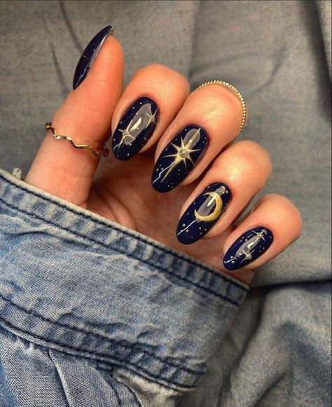 16. Black Nail Background With Gold Stars And Moon #blacknails #beauty #trendypins Navy Blue Celestial Nails, Nails With Moons And Stars, Acrylic Nail Designs Goth, Celestial Almond Nails, Black Nails With Moon, Black Moon Nails, Moon Phase Nails, Nail Art Black And Gold, Black Nails With Stars