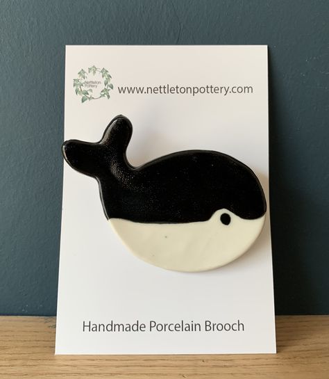 Handmade porcelain Whale brooch with a black  glaze. Approx 6cm x 5cm 10 GBP The post Whale Brooch – Black appeared first on The Market Co. Whale Brooch, Embroidered Brooches, Pottery Store, Creative Women, Air Dry Clay Projects, Mossy Green, Black Glaze, Handmade Porcelain, Rock Pools