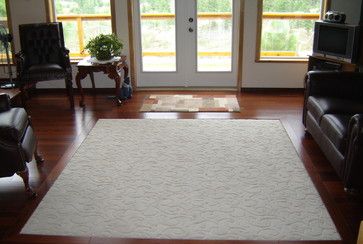 wood floor with carpet inlay.  I really like this one.  I must like the type of carpet they have... cut close to floor, but still having a nice design. Wood Floor With Carpet Inlay, Carpet Inlay, Mediterranean Family Room, Lounge Carpet, Tile Inlay, Living Room Wood Floor, Kitchen Carpet Runner, Deep Carpet Cleaning, Carpet Ideas