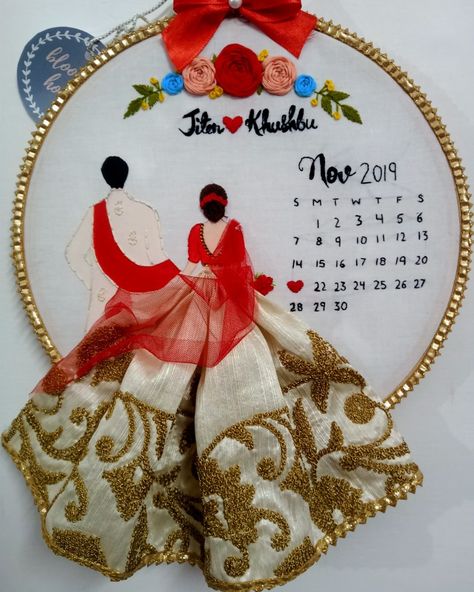 Customizable Bride & Groom Calendar Embroidered Hoop . Make any dates memorable with these intricately embroidered Bride & Groom Calendar wall hanging. You can customize the couple's name and date on it and gift it your loved one in a unique way for an anniversary or wedding gift. . #weddinghoops#customisedweddingifts#handmadegift#embroideryhoop#hoopart#embroiderywork#embroiderylove#handmadewithlove#weddingtheme#weddingstyle#weddingdate#floral#name#personalization#couplehoop Wedding Embroidery Hoop Couple, Wedding Hoop Art, Wedding Embroidery Hoop, Thread Craft, डिजाइनर कपड़े, Wedding Calendar, Unique Wedding Cards, Wedding Hoop, Embroidered Hoop