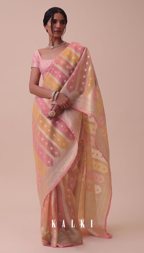 Elevate your style with our exquisite carrot orange saree adorned with rangkat designs.
Handloomed using the finest chanderi cotton kora silk fabric this saree exudes simplicity and elegance. Isha Borah, Saree Modern, Durga Chalisa, Saree Outfits, Sari India, Dhoti Saree, Kora Silk Sarees, Simple Saree Designs, Chanderi Saree