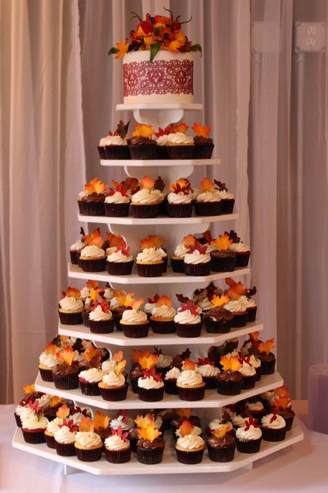 Fall Wedding Cupcake Tower, Fall Wedding Cupcake Display, Fall Cupcake Wedding Cake, Fall Wedding Cupcakes Rustic, Fall Wedding Treats, Autumn Wedding Cupcakes, Fall Wedding Dinner Ideas Food, Fall Wedding Cake Designs, Fall Wedding Cakes With Cupcakes