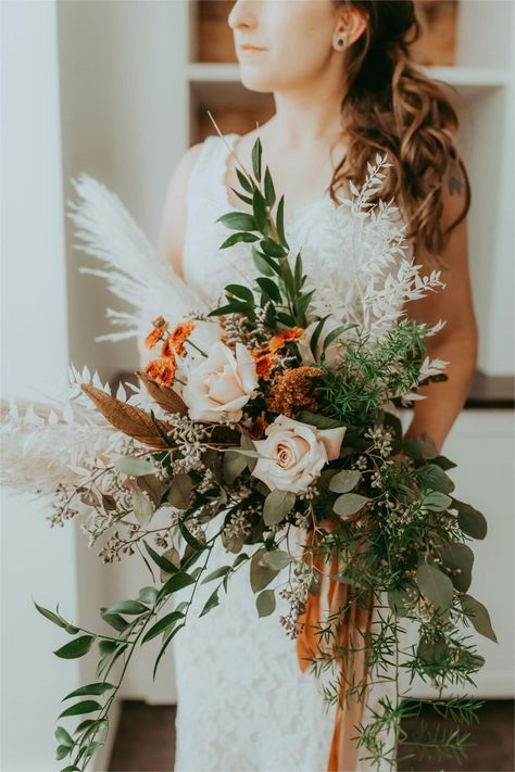 Fall boho bridal bouquet featuring eucalyptus, pampas grass, and dried florals. Pompadour Grass Wedding Bouquet, Rustic Boho Bridal Bouquet, Dried Eucalyptus Bouquet, Fall Boho Flower Arrangements, Pampas Grass And Eucalyptus Bouquet, Pampas Bouquet Wedding, Pampas Bridal Bouquet, Natural Bouquet Wedding, Pampas Bouquet