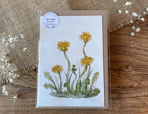 This item is a A6 Greetings card which features a printed design from one of my recent paintings depicting a handful of wild dandelions painted in watercolour and detailed with pen featuring a variety of vibrant yellow tones and bright green hues. This painting is a illustrated approach to the flower which is the resilient wild dandelion. The inside of this greeting card is blank so you can add your own message. This A6 Greeting card will be printed on 100% recycled natural 300gm  paper. The item u will recive is a high quality physical A6 Greeting Card printed on high quality recycled paper. The greeting card is blank inside and will come packaged in a biodegradable/compostable plastic sleeve with a craft brown envelope.   DISCLAIMER - THIS IS A PRINT NOT A ORIGINAL PAINTING. PLEASE BE AW Dandelion Painting, Brown Envelope, Green Hues, Brown Envelopes, Yellow Tones, Greetings Card, Blank Greeting Cards, Bright Green, Printed Design