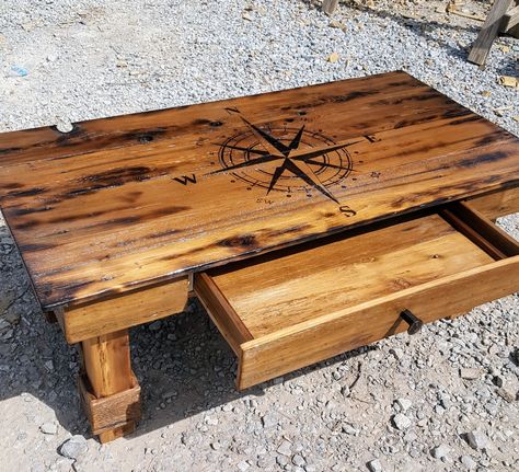 DIY Reclaimed wood coffee table with compass burned on top Table Wood Burning Ideas, Woodburning Table Top, Wood Burned Coffee Table, Wood Burned Table Top, Wood Burning Table Top Design, Pyrography Table, Wood Burned Table, Burnt Coffee Table, Burnt Wood Finish