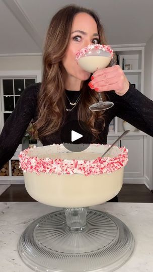 3.3M views · 122K reactions | Holiday Cake Stand Cocktail 2023! Cheers! Salute! Cin-cin! Ingredients: -⅓ cup vanilla frosting -1 ½ cup crushed candy canes -750 ml vanilla Vodka -750 ml Baileys -¼ cup powdered sugar -½ gallon milk of choice. I used oat milk -200 ml amaretto liquor -Invert a cake stand as shown. Add crushed candy canes to a flat dish. -Rim the edge with frosting and coat with crushed candy canes -Fill a large pitcher ½ way with ice. -Add all ingredients to the pitcher and mix well. -Using a colander, strain the ingredients into the inverted cake stand as shown. | Ereka Vetrini | Meghan Trainor · Holly Jolly Christmas Cake Stand Cocktail, Amaretto Liquor, Holiday Boards, Parmesan Crusted Potatoes, Creamy Cocktails, Holiday Cake, Christmas Foods, Christmas Cocktail, Vanilla Vodka