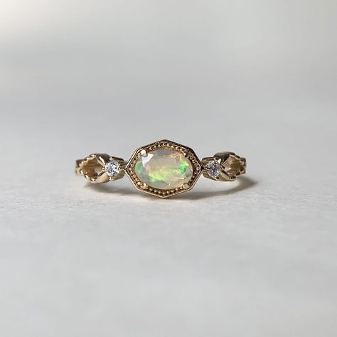 Vintage Gold Opal Engagement Ring Three Stone Promise Ring Natural Fire Opal Oval October Birthstone Rings for Women E393 💛 RING INFORMATION 💛 * Made to Order * Stone: natural african opal,cubic zirconia * Metal: Gold plated 925 sterling silver,if you need Solid 10k 14k 18k gold/white gold/rose gold,please contact me. 💛 FREE SHIPPING Beautiful gift box included. 💛 SIZES Please drop down the Options box to choose the ring size,if you can't sure the size,please go to the nearest local jewel shop to measure it. 💛 Thank you for visiting our shop! Feel free to contact me if you have any questions :) Opal Engagement Ring Gold, Vintage Engagement Rings Opal, Wedding Rings Opal, Oval Opal Engagement Ring, Opal Engagement Ring Vintage, Gold Opal Engagement Ring, Vintage Opal Ring, Opal Promise Ring, Opal Stone Ring