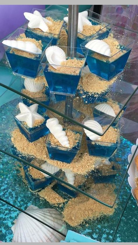 Sea shells jello Mermaid Jello Ideas, 7 Seas Birthday Party, Luca Party Food, Blue Mermaid Birthday Party, Ariel Themed Food, Quinceanera Mermaid Theme, Mermaid Beach Party Ideas, Sea Shell Party Decoration, Luca Dessert Table