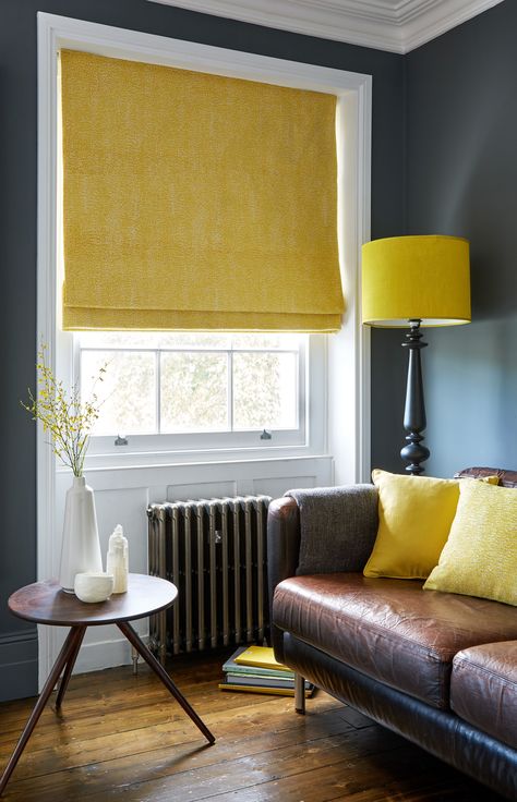 Wooden floors, leather sofa and a pop of yellow with blinds and accessories creates a gorgeous, sophisticated lounge. #LeatherFlooring